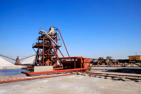 Sea salt production. machinery for the treatment of the salt, The equipment and salt stock of a salt plantの写真素材