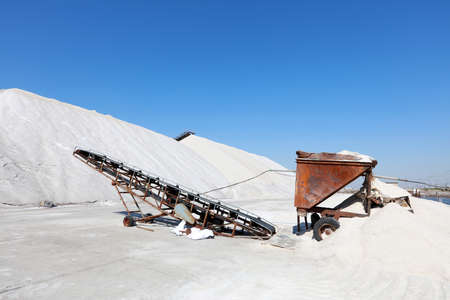 Sea salt production. machinery for the treatment of the salt, The equipment and salt stock of a salt plantの写真素材