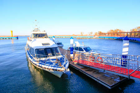 The boat is in the dock, the boat is moving, the yacht is in the dockの写真素材