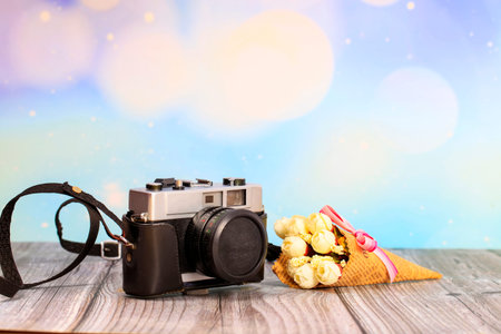 Retro camera on a wooden table, close-up
