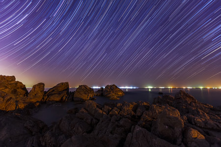 Seaside scenery, sea at night and beautiful Milky Way, sea and star tracksの写真素材
