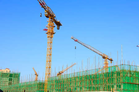 The construction site, the construction worker's tower crane, Residential buildings are under constructionの写真素材