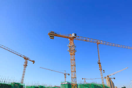 The construction site, the construction worker's tower crane, Residential buildings are under constructionの写真素材