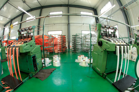 Packaging bag production workshop, The production workshop of woven belt, A factory workshop where textile belts are producedの写真素材