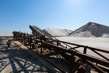 Sea salt production. machinery for the treatment of the salt, The equipment and salt stock of a salt plantの写真素材