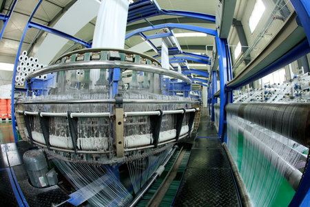 Packaging bag production workshop, The production workshop of woven belt, A factory workshop where textile belts are producedの写真素材