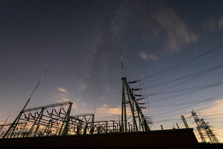 Pylon and star, pylon and the Milky Way, The high voltage substation is under the starsの写真素材