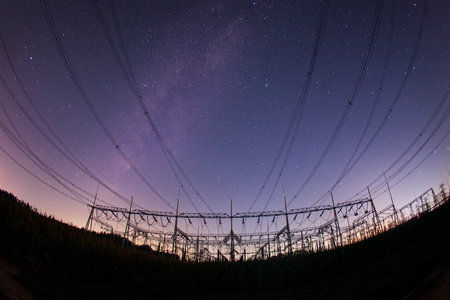 Pylon and star, pylon and the Milky Way, The high voltage substation is under the starsの写真素材