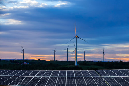Solar photovoltaic panels and wind turbines. Energy conceptの写真素材