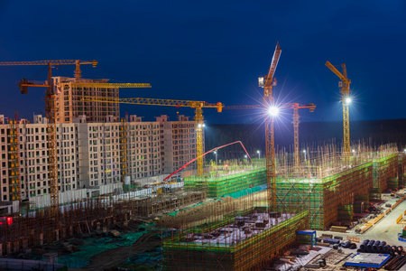 The building site is in the evening, Tower cranes build residential buildingsの写真素材