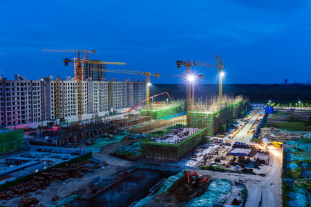 The building site is in the evening, Tower cranes build residential buildingsの写真素材