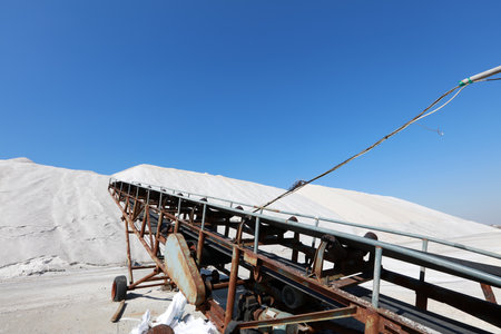 Sea salt production. machinery for the treatment of the salt, The equipment and salt stock of a salt plantの写真素材