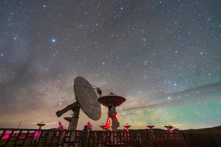 In observatories, satellite antenna radio telescope on the background of stellar tracks, radio telescope on the background of stellar tracks, The observatory's radio telescopeの写真素材