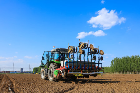 In spring, farmers use farm machinery to grow peanuts. Farmers use tractors to grow peanuts