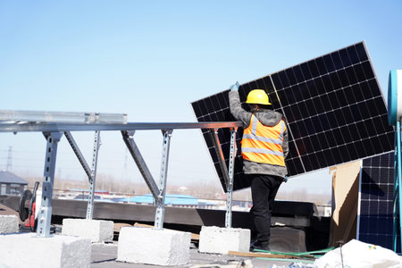 Workers install solar photovoltaic panels, Workers repair solar photovoltaic power generation equipmentの写真素材