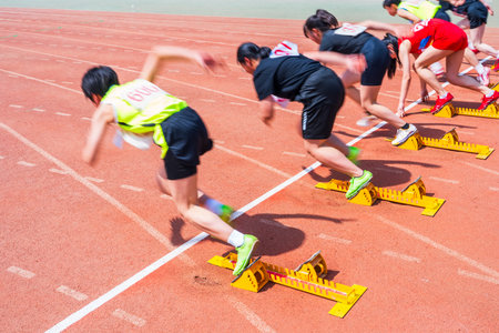 Sports meeting, the athlete sprint starts, the sprinters are at the starting lineの写真素材