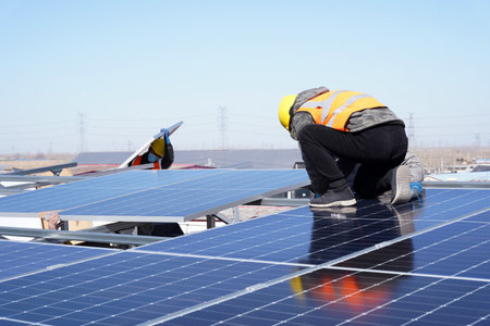 Workers install solar photovoltaic panels, Workers repair solar photovoltaic power generation equipmentの写真素材