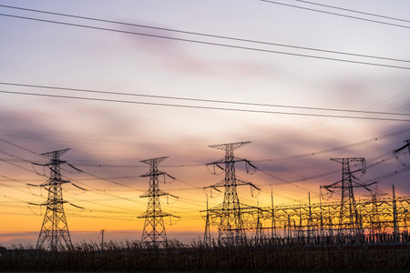 The pylons are in the evening, Substation in the evening, the silhouette of the power supply...