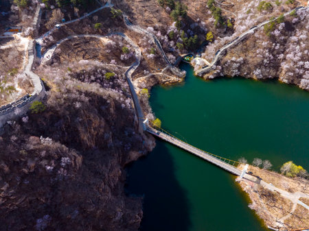 The Great Wall is in China. The Great Wall in spring, the mountains are full of flowers, the Great Wall and the lakeの写真素材