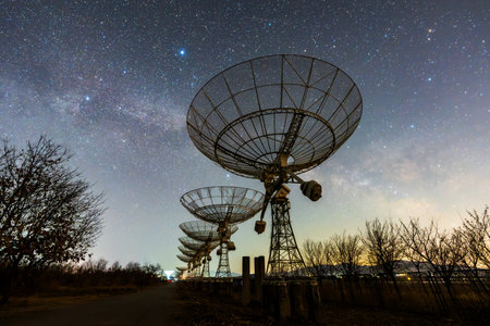 In observatories, satellite antenna radio telescope on the background of stellar tracks, radio telescope on the background of stellar tracks, The observatory's radio telescopeの写真素材