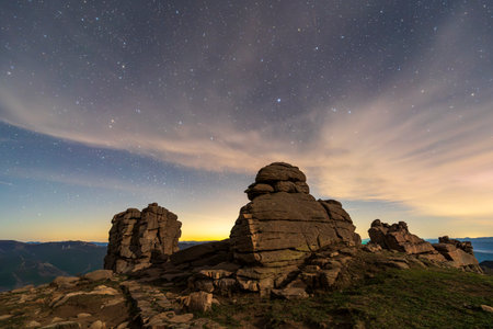 The strange rocks on the mountain are under the stars. the mountain is under the Milky Wayの写真素材