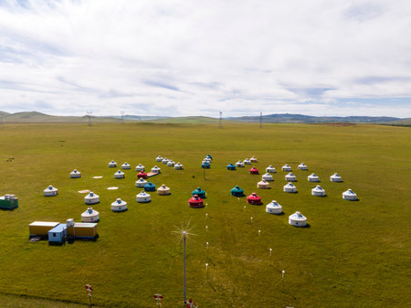 The yurt is under the blue sky and white clouds, yurts in the beautiful grassland, Mongolian yurt on...