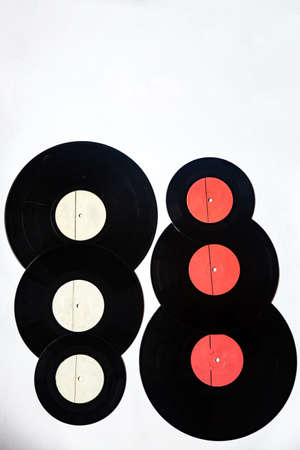 Vinyl records of different diameters on a white backgroundの写真素材
