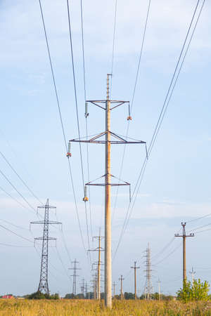 Power lines in the field (high voltage wires)の写真素材