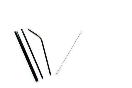 Black metal reusable straws for drinks on white background. no plasticの写真素材