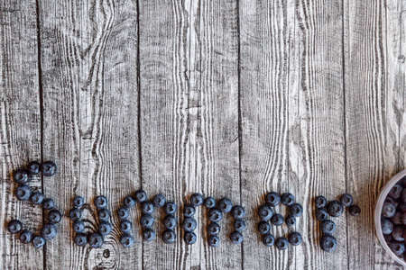 Summer made with fresh blueberries on the gray wooden background. Vegan and vegetarian concept.の写真素材