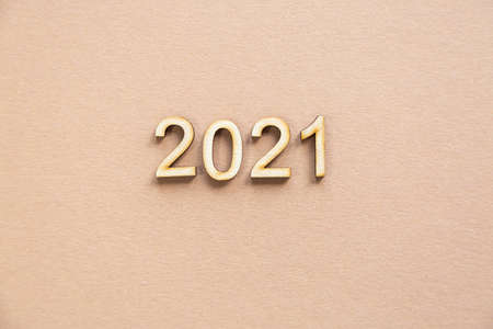 2021 wood festive composition on a beige background with copy space. new year and christmas conceptの写真素材