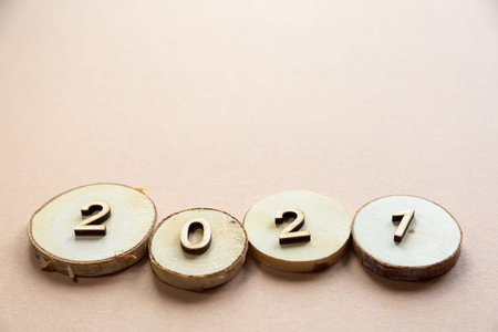 2021 wood festive composition on a beige background with copy space. new year and christmas concept