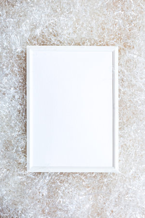 White photo frame on a light background. Delicate, light, minimalistic mock up