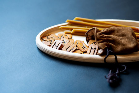 Modern, minimal still life with runes on table. Magic ritual, esoteric and occult background with...