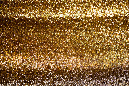 Gold textured image background. Shiny, golden surface. Abstract glowing texture.