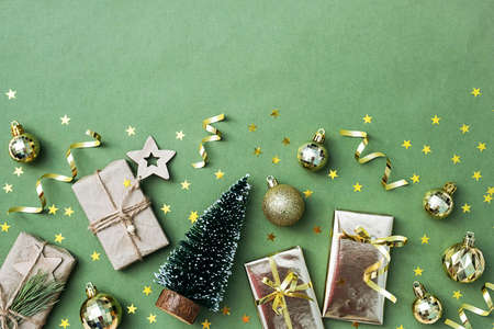 Christmas tree, gift boxes Christmas balls flat lay, copy space. Trendy winter holidays ornament.の写真素材