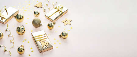 Christmas composition from gift boxes, christmas balls, serpentine, confetti view from above.の写真素材