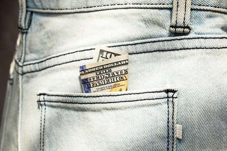 US 100 dollar bill in pocket of jeans.  Money inside  jeans pocket.の写真素材
