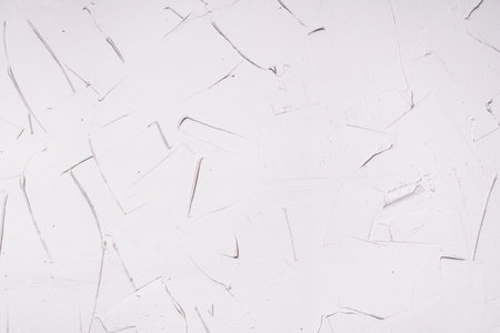 Decorative plaster texture. Grange, uneven stucco surface.の写真素材