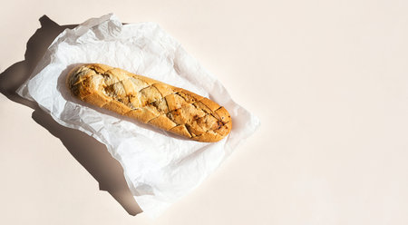 Wheat bread loaf on parchment paper.