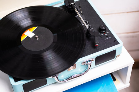 Analog vinyl record player with disc. Modern turntable audio equipment, close up.の写真素材