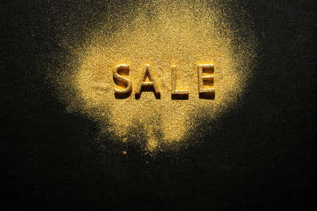 Sale - golden word on black. Online sale or clearance store concept.の写真素材