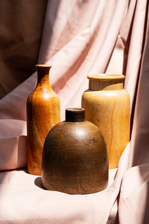 Wooden vases on textile background. Aesthetic vintage home decor collection.の写真素材