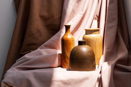 Wooden vases on textile background. Aesthetic vintage home decor collection.の写真素材