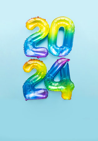 2024 numbers by rainbow foil balloons. New Year layout.の写真素材