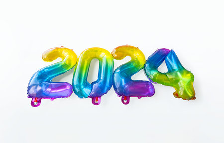 2024 New Year concept by rainbow foil balloons numbers.