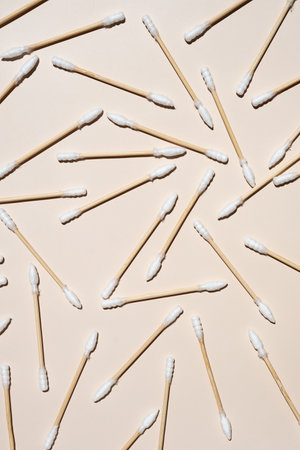 Bamboo cotton ear swabs layout in neutral colors.の写真素材