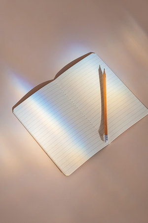 Empty open notepad in sunlight flare leak.