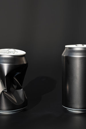 Two used aluminum beverage cans. Black soda can mock up.の写真素材