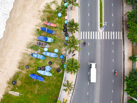 Drone view boats on the beach. Highway near seashore aerial shot.の写真素材